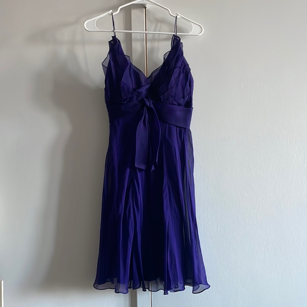 Dark purple flare dress with spaghetti straps and bow front, side zip